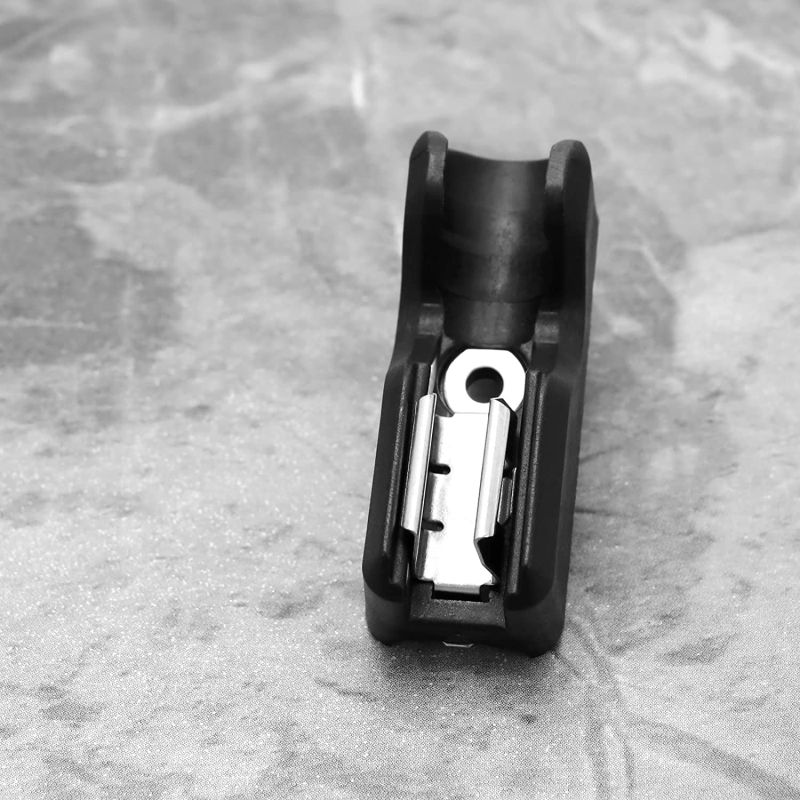 A black belt clip hook bit holder for cordless drills, shown in a close-up against a gray background.