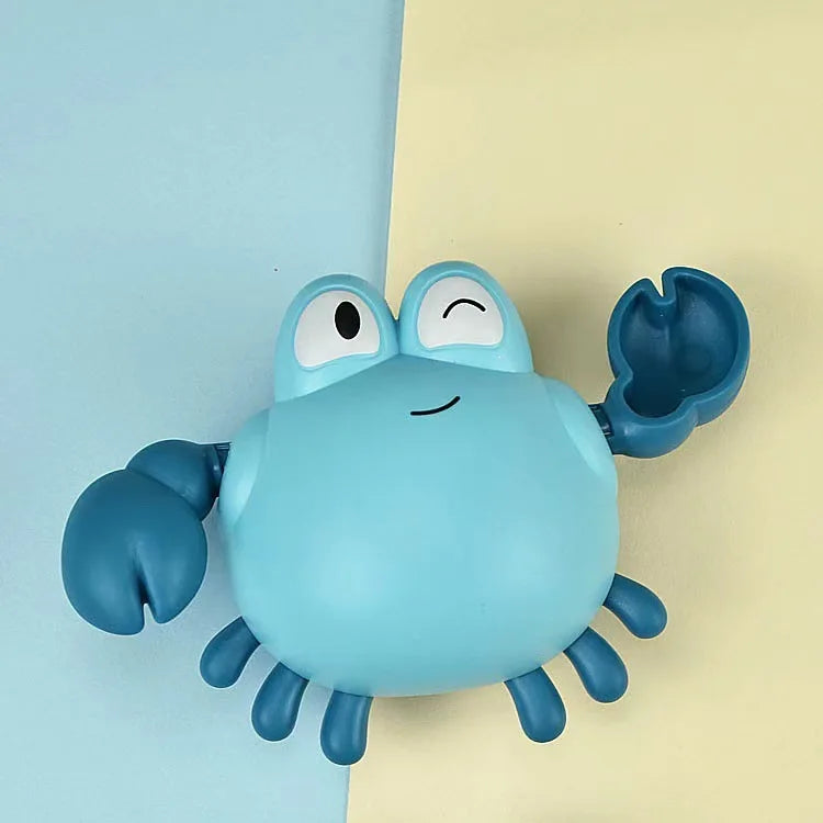 A blue cartoon turtle bath toy with large eyes and flippers is shown against a light yellow background.