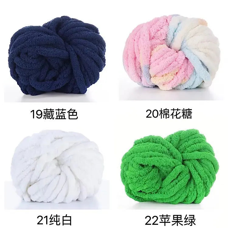 A collection of chunky acrylic yarn skeins in various colors including navy blue, pink, white, and green.