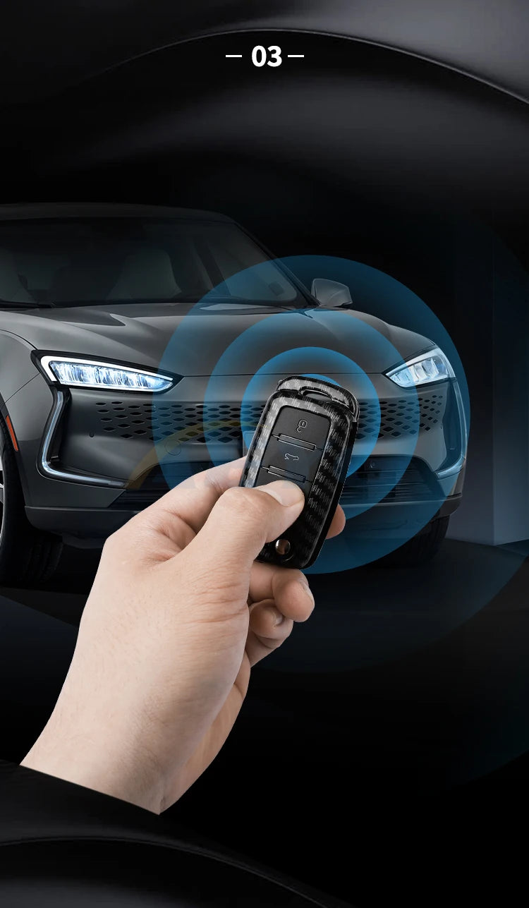 A hand holds a carbon fiber car key cover near the headlight of a dark car, with a blue circular graphic overlay.