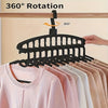 Black multi-layer space-saving closet organizer hangers demonstrating 360 degree rotation.