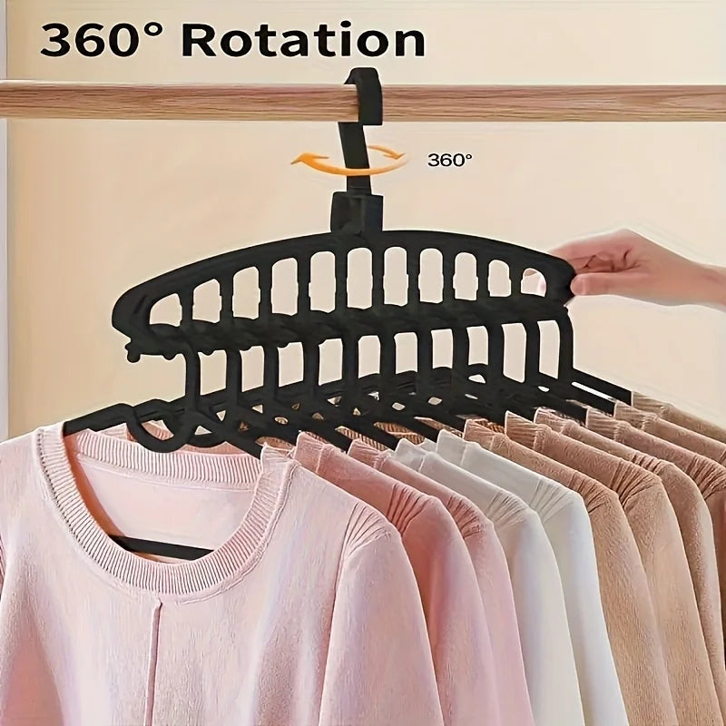 Black multi-layer space-saving closet organizer hangers demonstrating 360 degree rotation.