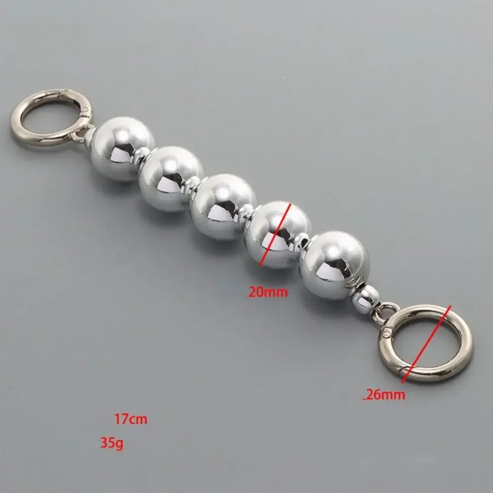Silver pearl strap replacement for handbags featuring a chain and a loop.