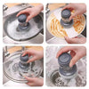 Hands demonstrate using a press dish brush with a built-in soap dispenser to clean dishes.