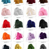 A collection of velvet drawstring jewelry pouches in various shades of red, pink, yellow, and green.