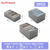 Three gray fabric storage boxes for organizing folded underwear, socks, and accessories in grid compartments.