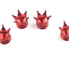 A set of four shiny red universal crown valve caps arranged horizontally on a white background.