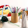 A collection of 23 crochet hooks, including bamboo cables and various colored hooks, stored in a cardboard container.