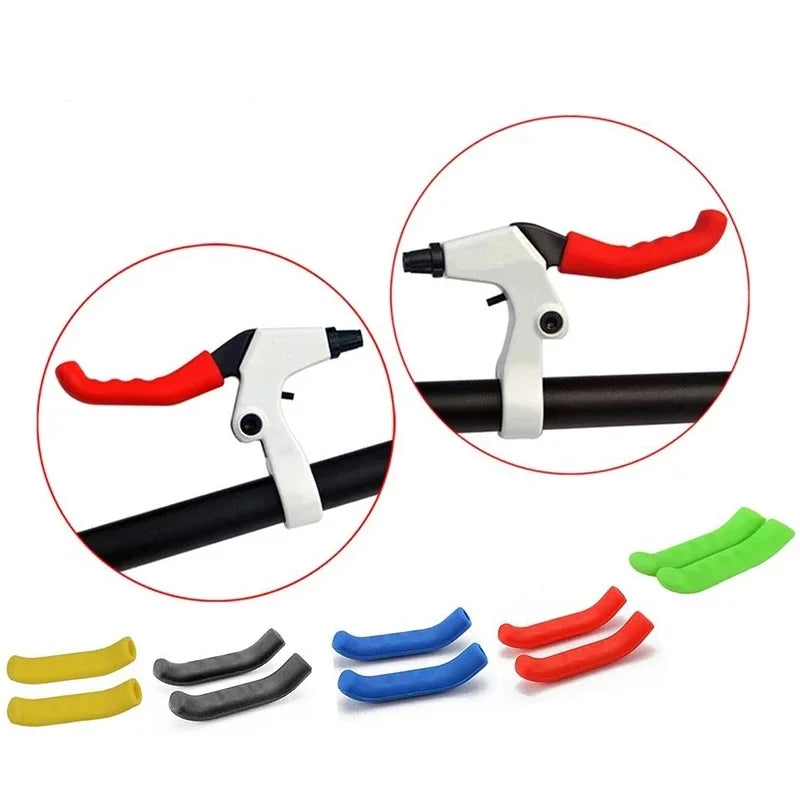 A pair of silicone bicycle brake lever covers in yellow, gray, and red colors shown with a black lever.