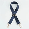 A dark navy nylon bag strap with a gold buckle and metal clasps.