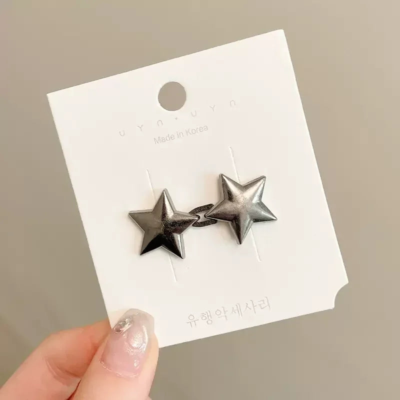 Silver star brooch belt buckle made in Korea on a white card
