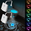 A white rechargeable motion sensor toilet night light with a glowing blue light and multiple color modes is shown on a toilet
