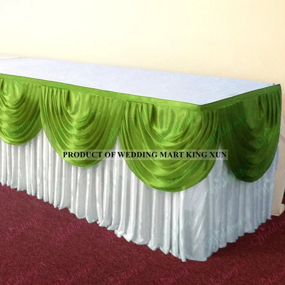 Elegant ice silk table skirt with matching top swag in green and white.