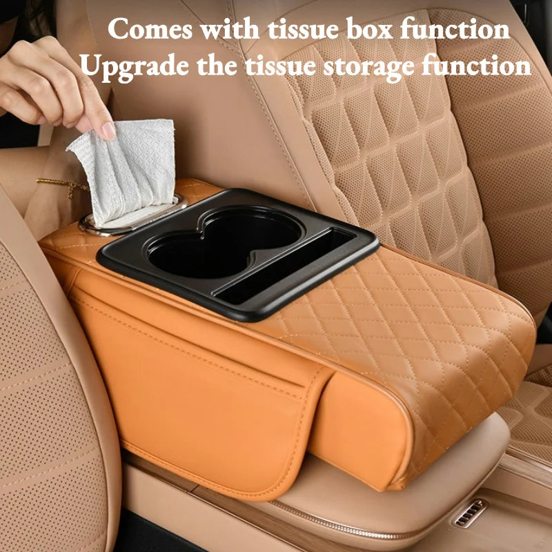An orange car armrest cushion with a tissue box function and storage compartment is shown in a vehicle interior.