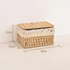 A rectangular handwoven rattan storage basket with a lid, showing its dimensions.