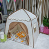 A beige and white foldable kids teepee play tent with a brown entrance and interior bedding.