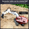 A white YIGONG excavator table is shown with a remote control unit and tracks in a dirt excavation context.