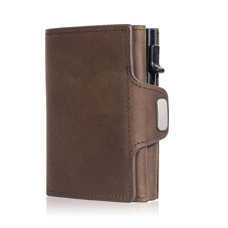 A brown leather card holder wallet with a pop-up feature and a black closure visible.
