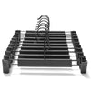 Black space-saving adjustable clip hangers for pants, skirts, and trousers.