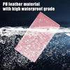 A pink PU leather material card floating on water with splashing droplets.