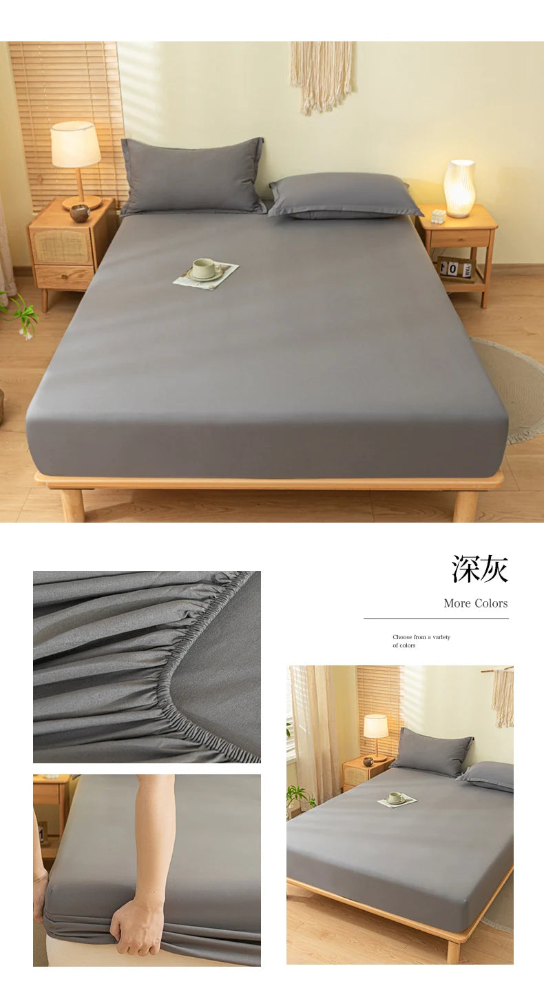 A gray soft brushed fitted sheet is displayed on a bed, showing its texture and elastic edge.