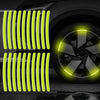Bright yellow reflective strips installed on a car wheel rim.