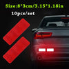 Ten reflective red car safety strips for night and low-light visibility shown on a dark car body.