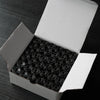 A white box containing numerous prewound bobbins with 60wt polyester thread for home embroidery machines.
