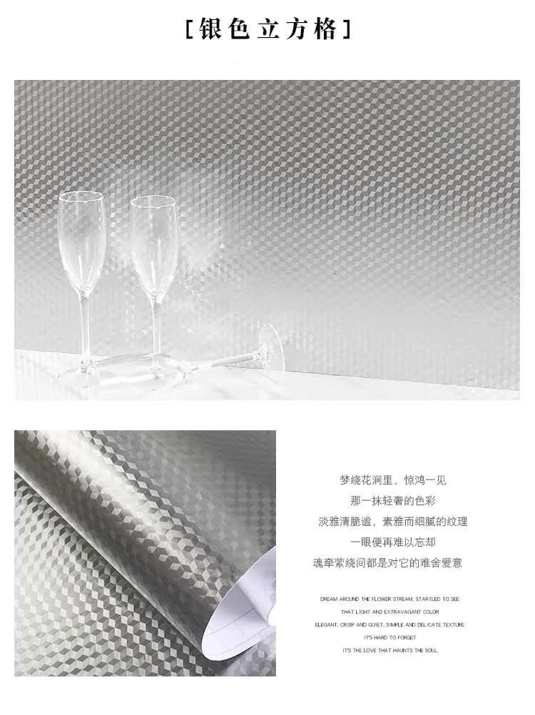 Brushed silver peel-and-stick metal wallpaper featuring a subtle geometric pattern on a surface.