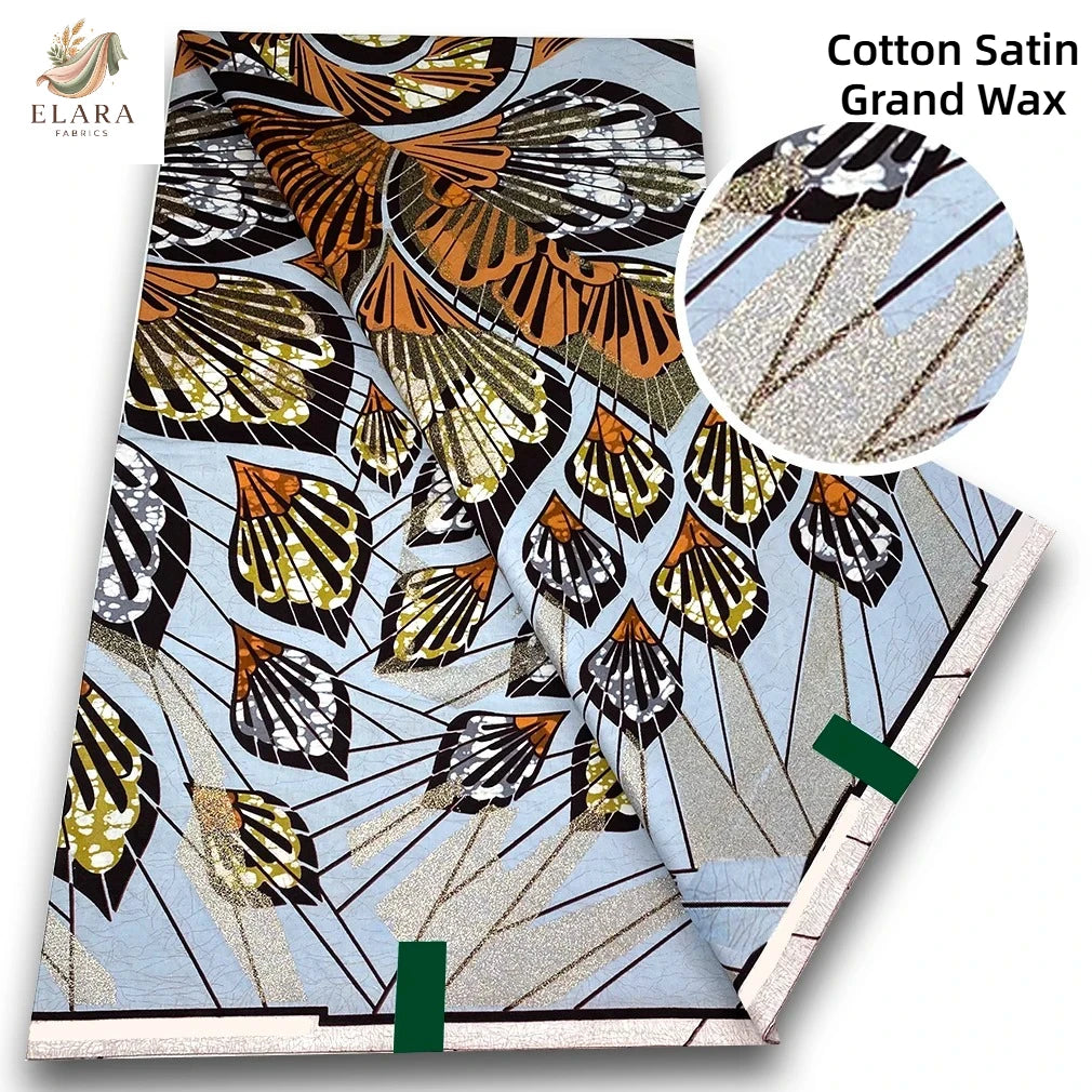 Cotton Satin Grand Wax fabric featuring a patterned print with gold and black designs.