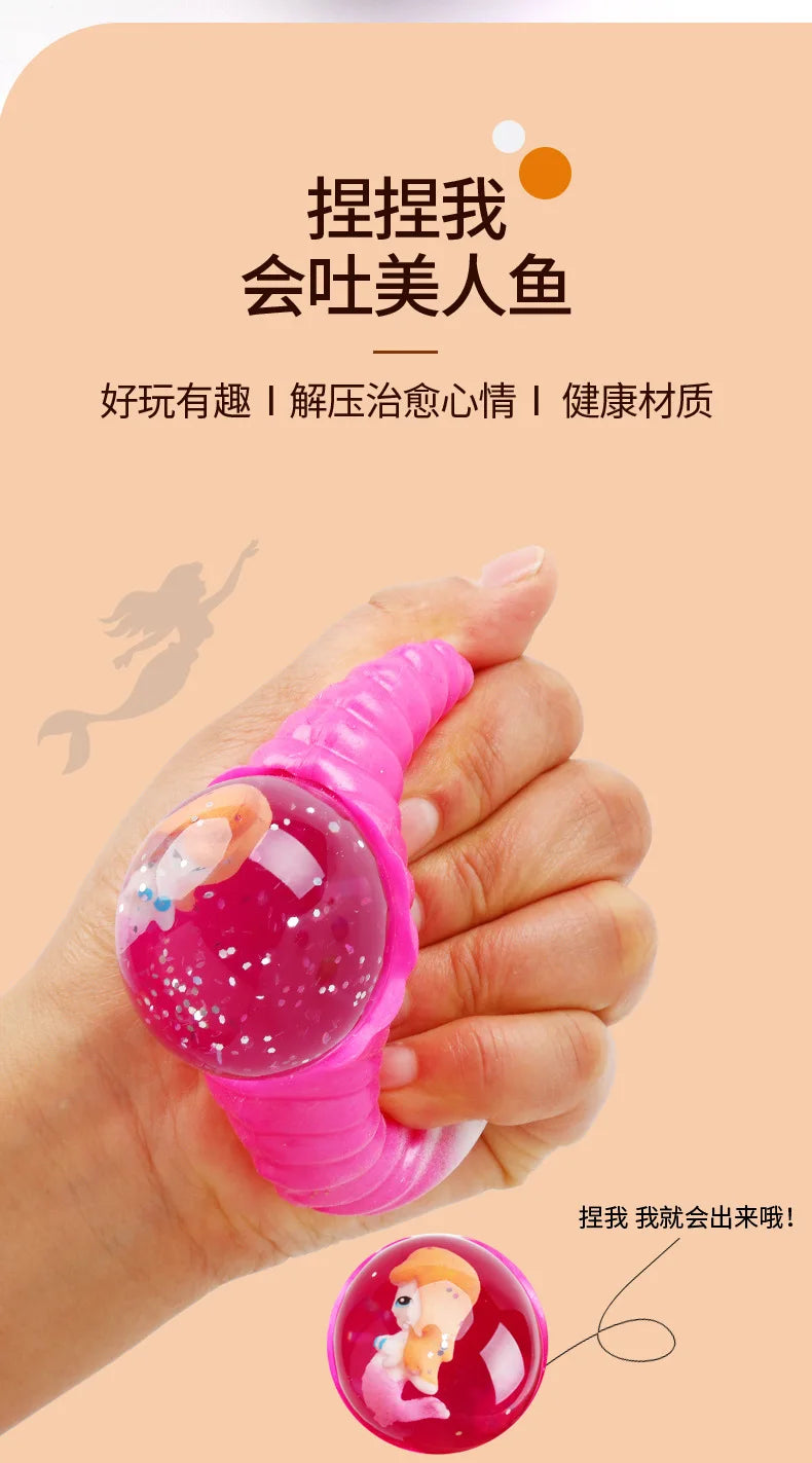 A hand is squeezing a pink, translucent ball with glitter inside, demonstrating a stress relief fidget toy.
