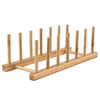 A wooden dish drying rack made of bamboo with multiple vertical rods for drying dishes.