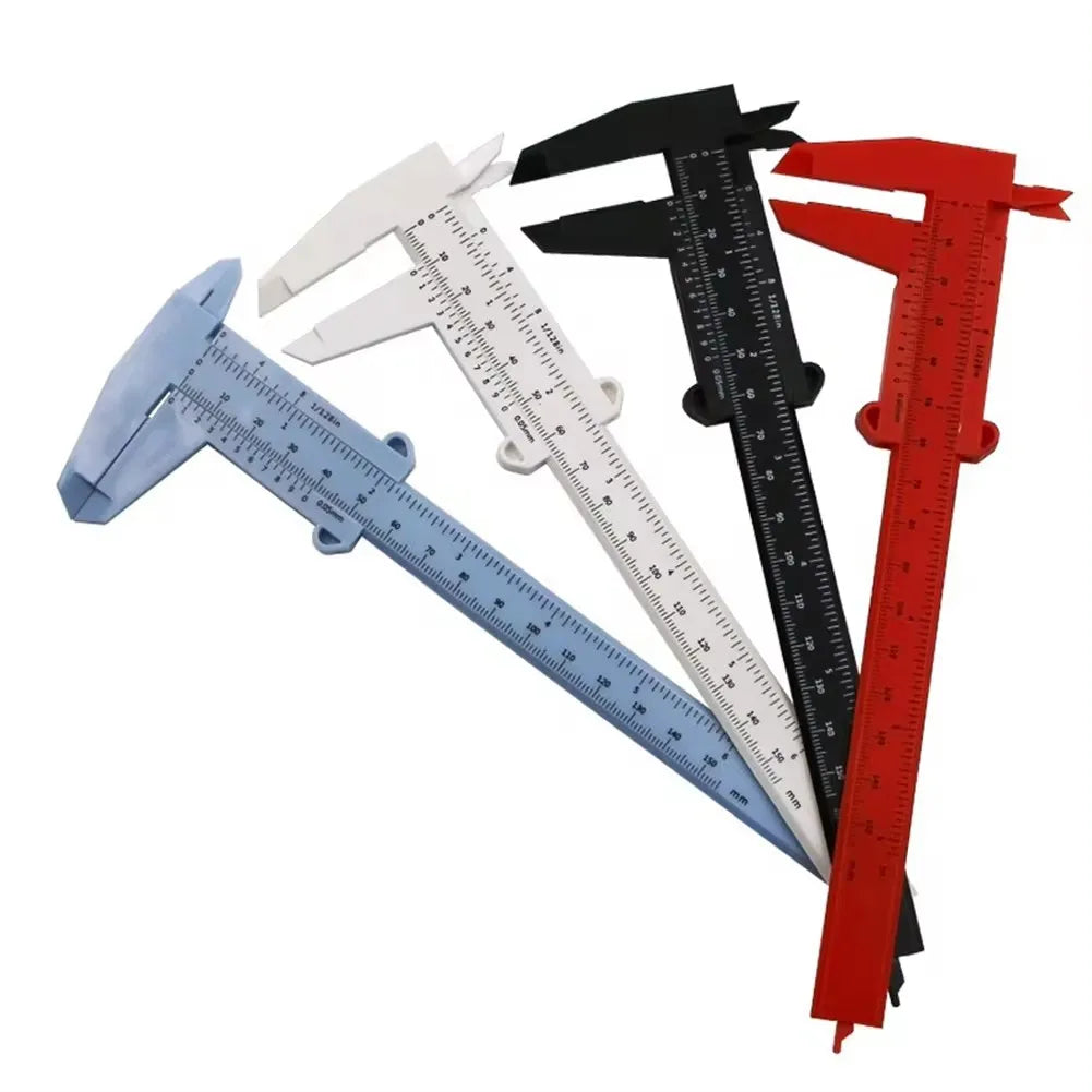 A set of three plastic vernier calipers in blue, white, and red showing different measurement scales.