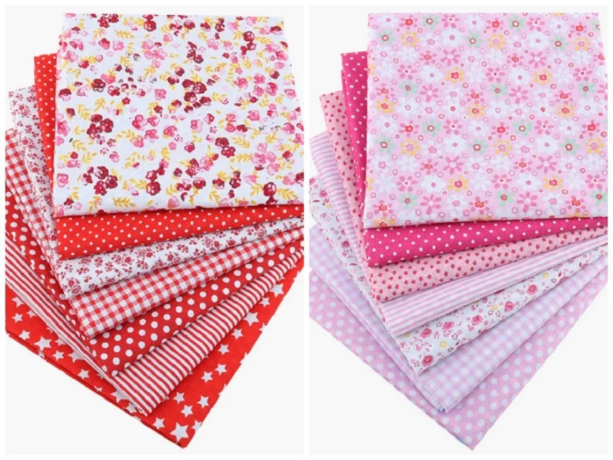 A bundle of pink, red, and white cotton fabric squares featuring floral dot patterns for patchwork and quilting.