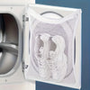 A white reusable mesh shoe wash bag is shown inside an open washing machine door.