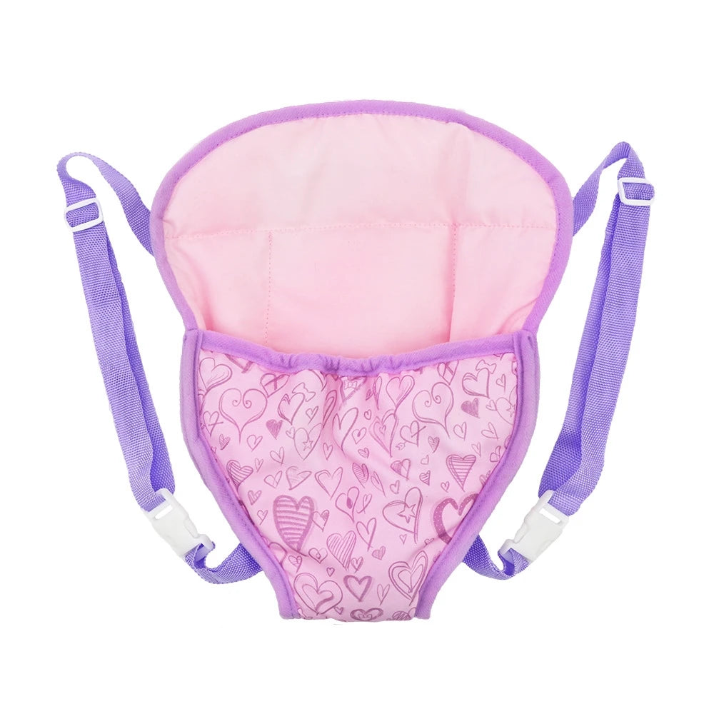 Pink doll carrier backpack with purple adjustable straps and a heart-patterned fabric