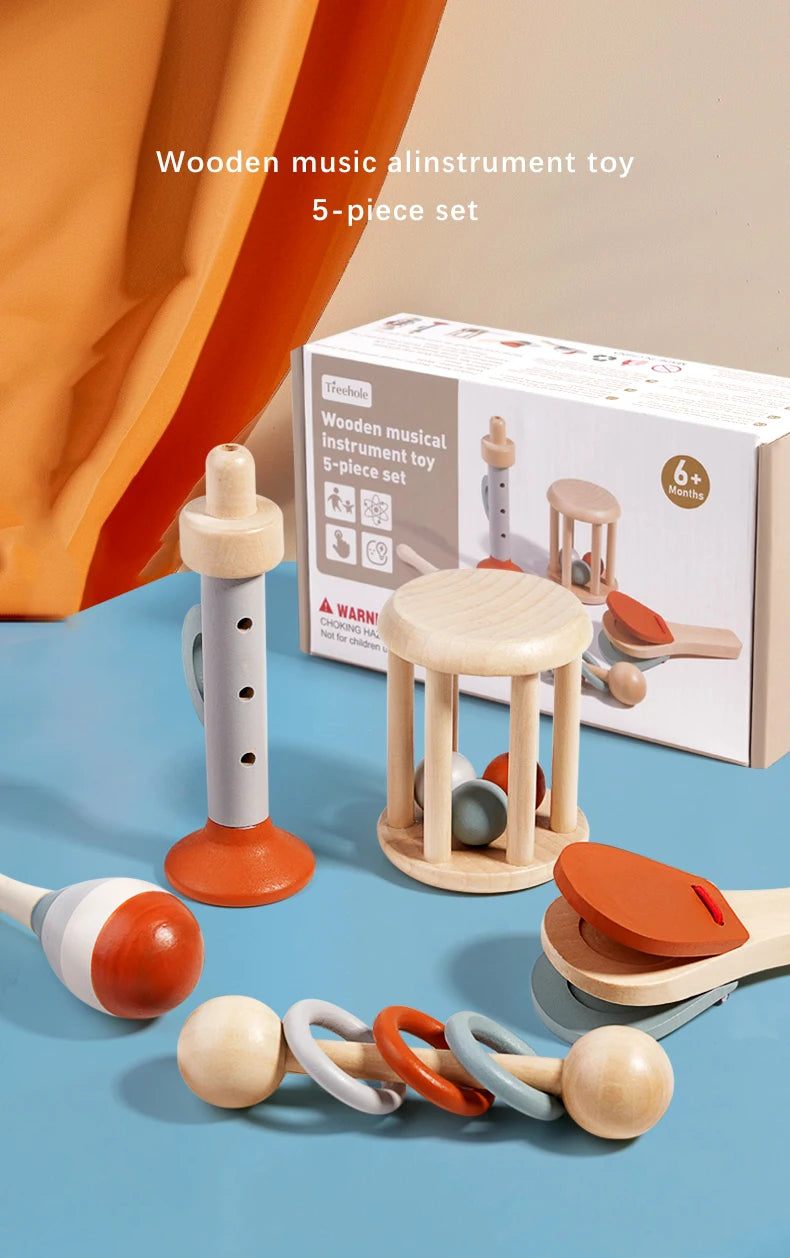 A set of five wooden musical instruments including a rattle, bell, and various wooden toys for babies.