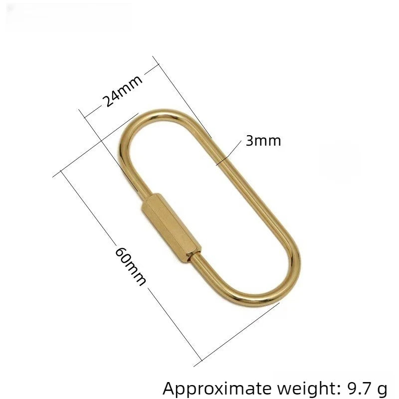 A brass gold keychain charm with a secure carabiner clip shown with dimensions.