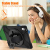 A woman is using a shockproof case with a stand for an iPad on a table.