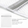 Close-up of a white mesh laundry bag with a silver zipper, showing internal curling and ripstop fabric structure.