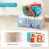 A colorful tissue box filled with crinkle scarves and double-sided patterned sound paper for sensory play.