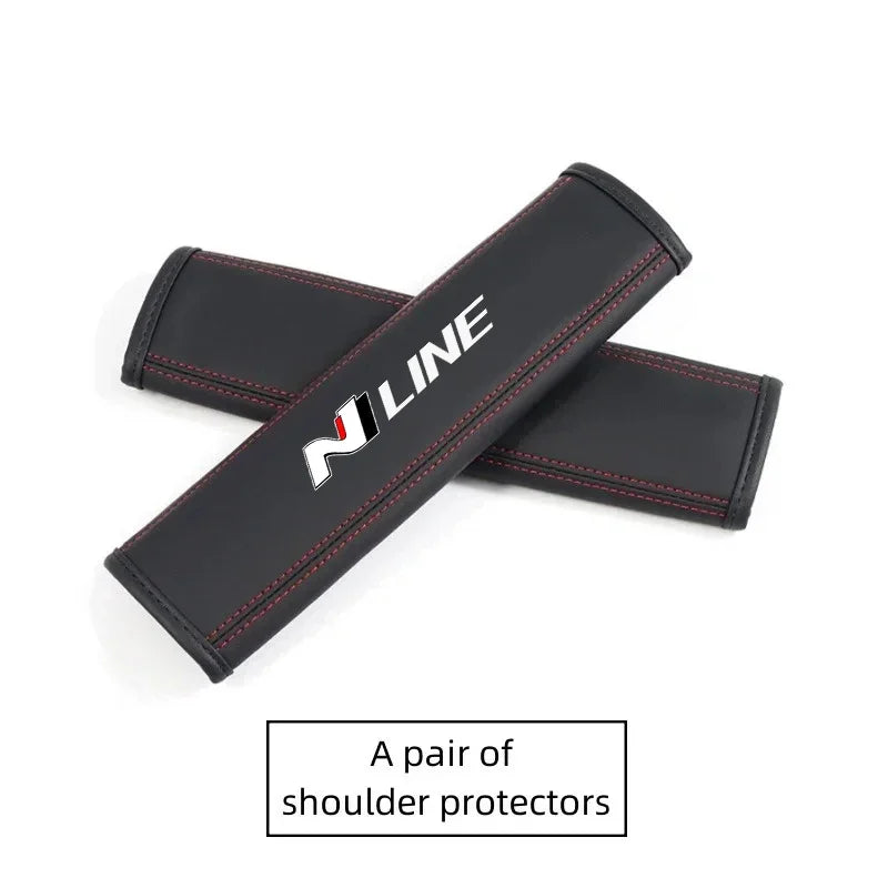 A pair of black PU leather shoulder protectors for car headrests and seatbelts