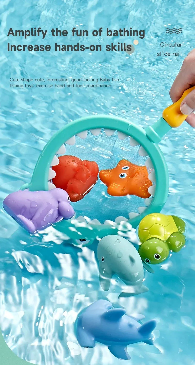 A hand holds a green plastic catch net filled with colorful floating bath toys including a turtle and a shark in clear water.