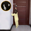 A child is demonstrating the operation of a cabinet lock on a wooden door, showing how to secure it.