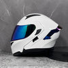 A white modular flip-up motorcycle helmet with a reflective blue visor displayed against a gray background.