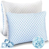 A light blue patterned memory foam pillow with a white quilted cover and loose blue foam pieces.