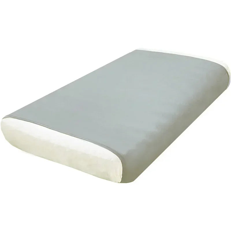 A rectangular, light gray breathable stretchy sensory bed sheet with a white border.