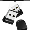 A display showing a compact black USB flash drive and its corresponding adapter.
