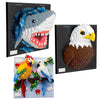 Three framed mosaic wall art kits featuring a shark, an eagle, and a colorful bird.