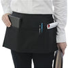 Classic black waist apron with three pockets worn by a person in a white shirt.